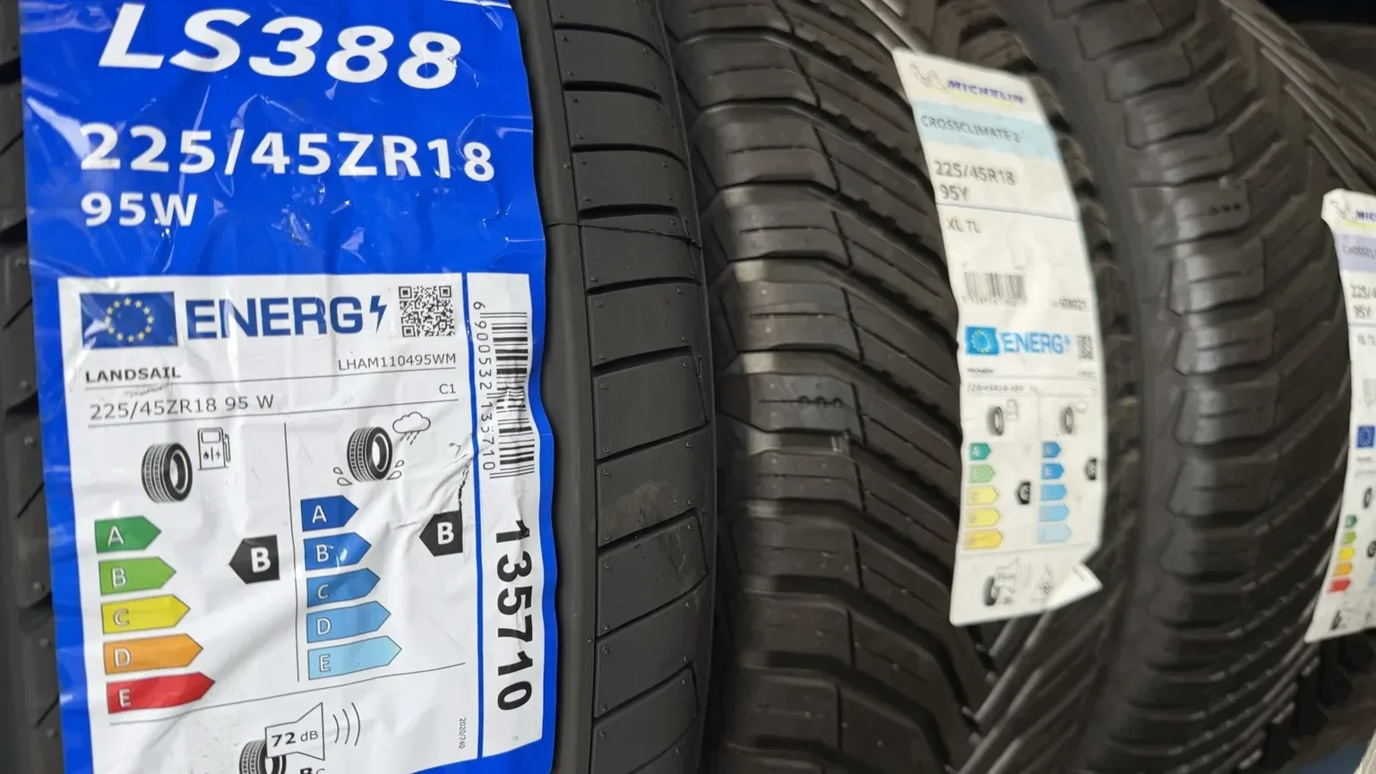 Tyre inspected for a puncture repair on a driveway