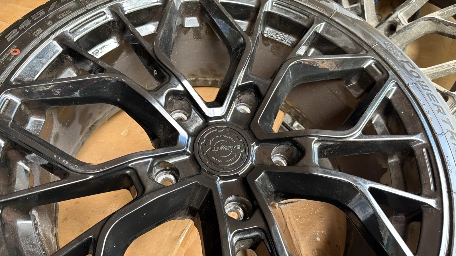 Refurbished black alloy wheel with new tyre fitted
