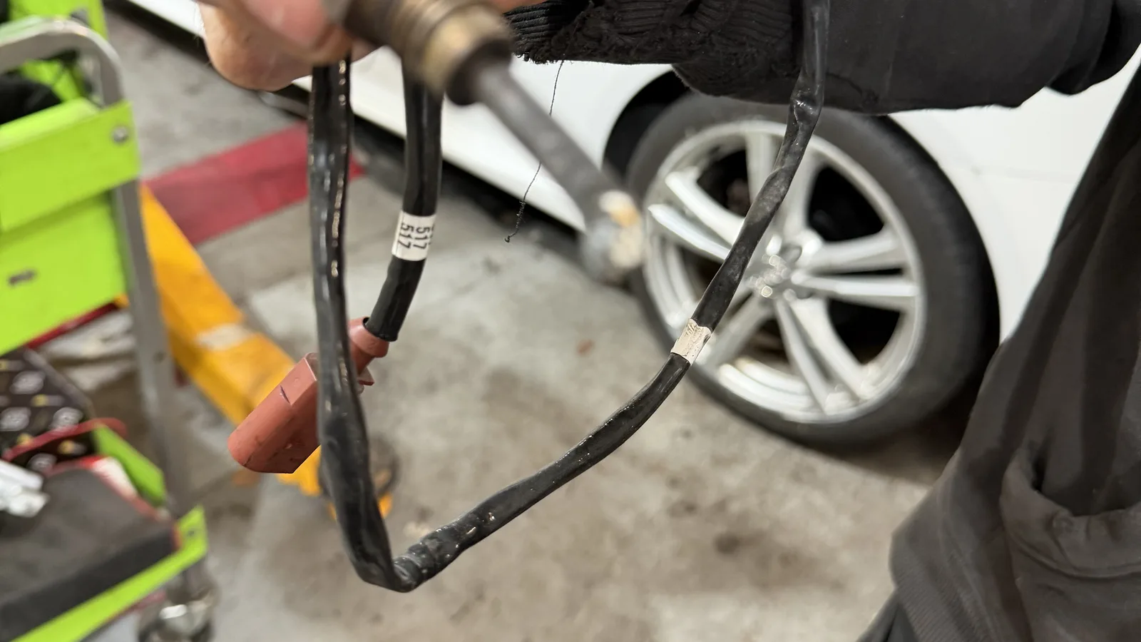 TPMS valve sensor being fitted by hand