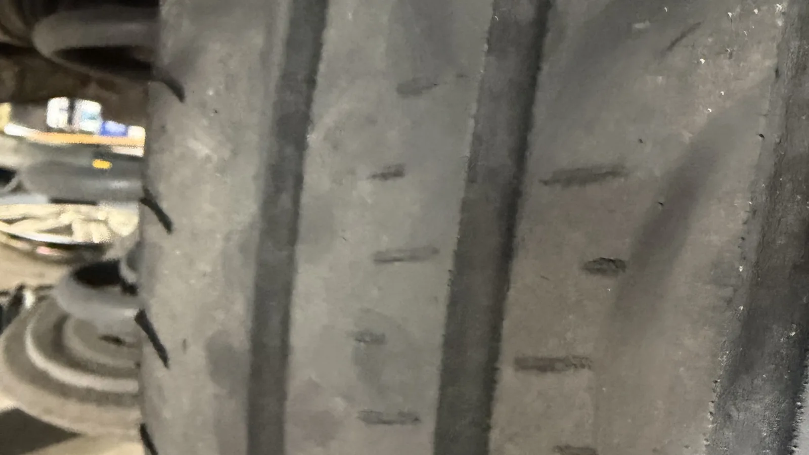 A worn tyre with the wear bars level with the tread